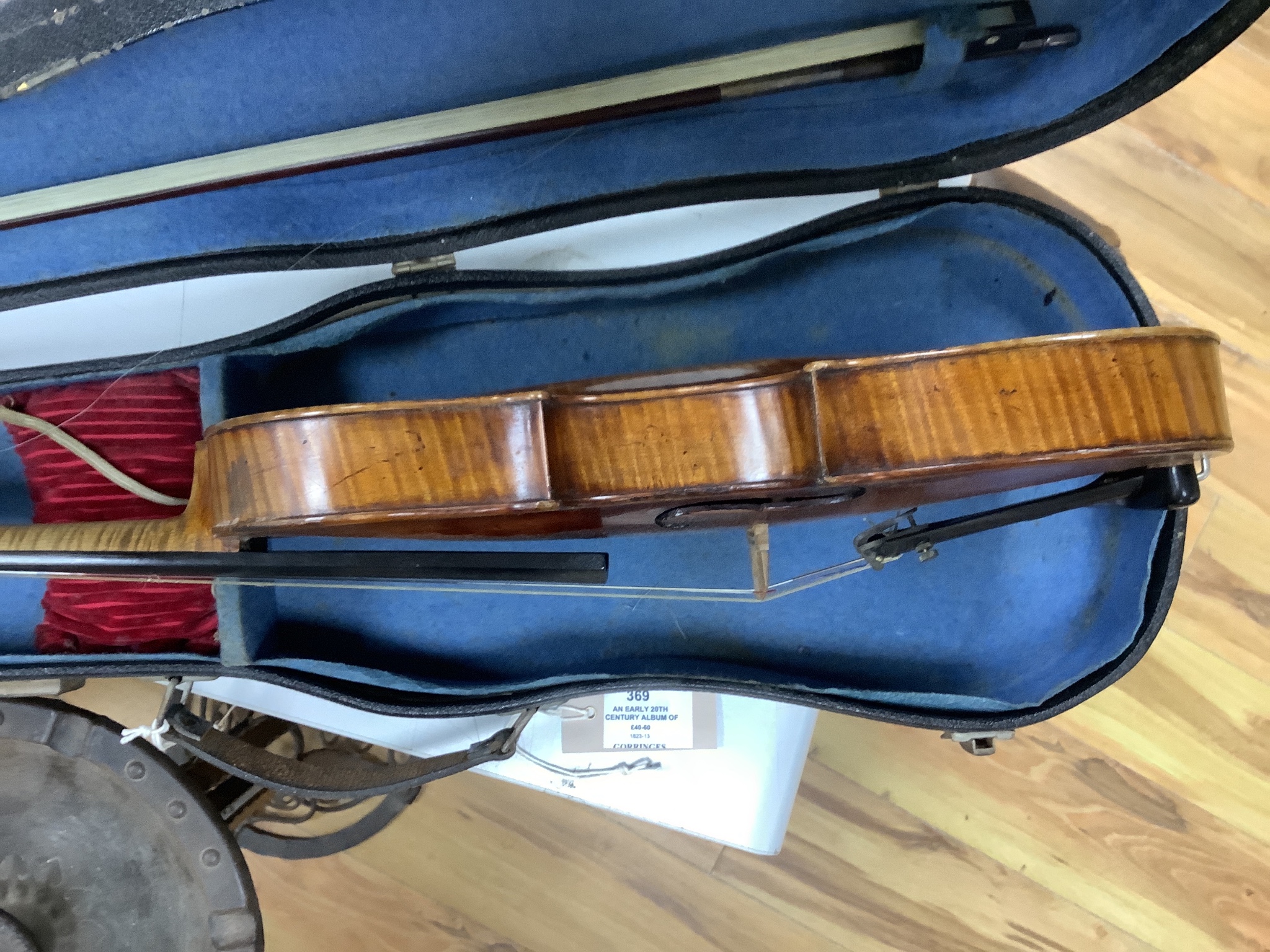 A cased violin and bow